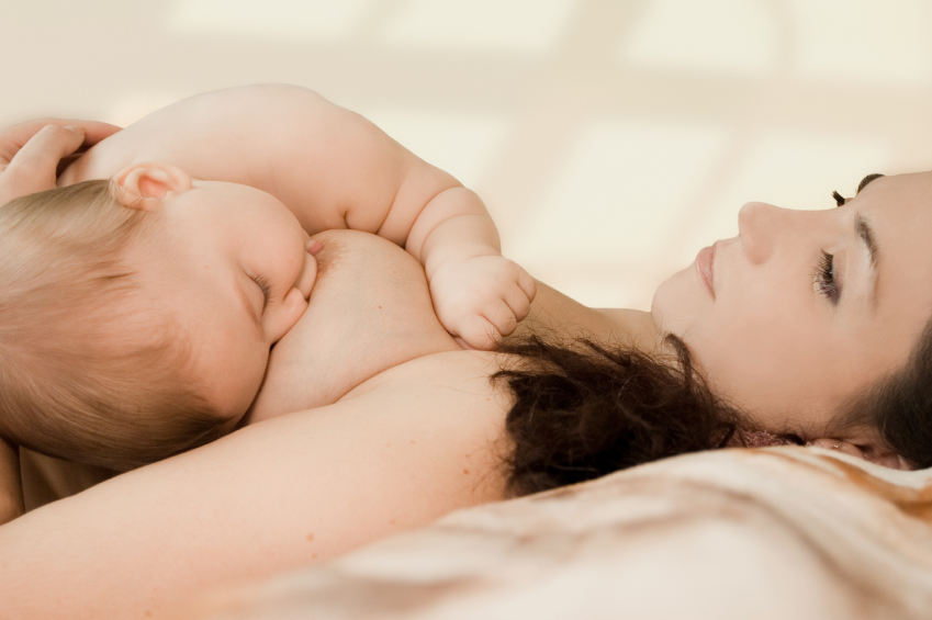 Mother breast-feedes the kid