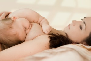 Mother breast-feedes the kid